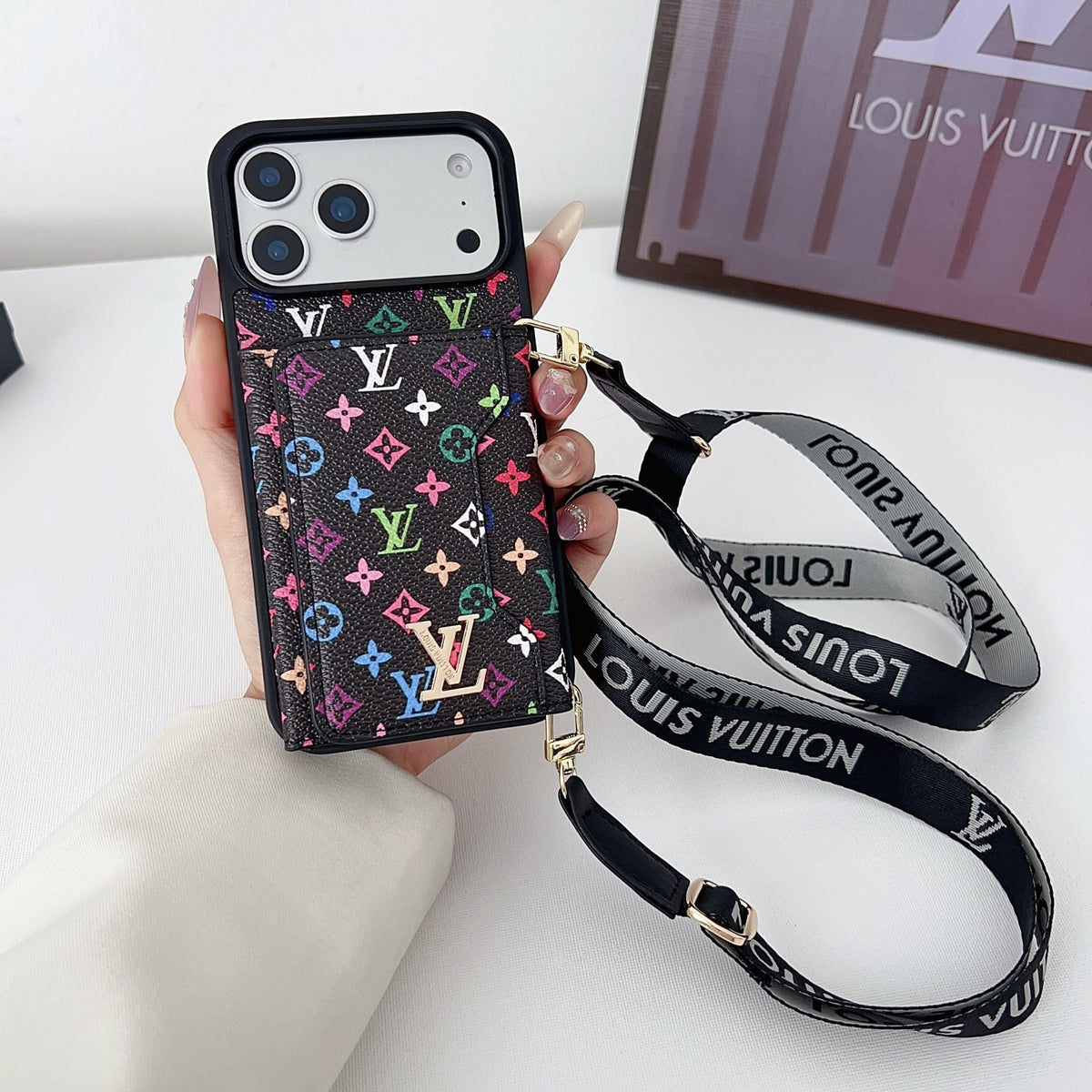 Multicolor monogram LV crossbody wallet iPhone case showing the full patterned back and fitted corners