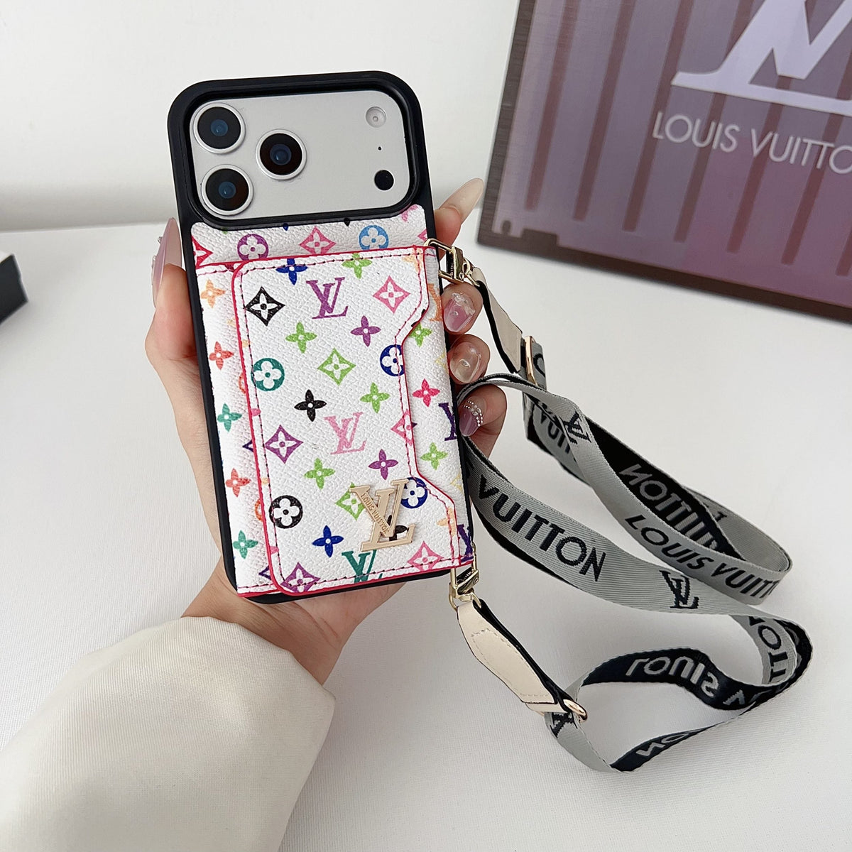 Multicolor monogram LV crossbody wallet iPhone case showing the card holder, camera area and carrying strap