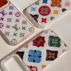White multicolor monogram LV iPhone case close-up showing the bright pattern and material finish