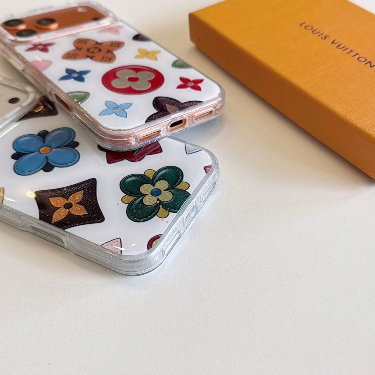 White multicolor monogram LV iPhone case showing the slim protective profile and colorful back
