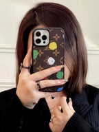 LV paint spots iPhone case close-up showing the artistic finish and fitted edges