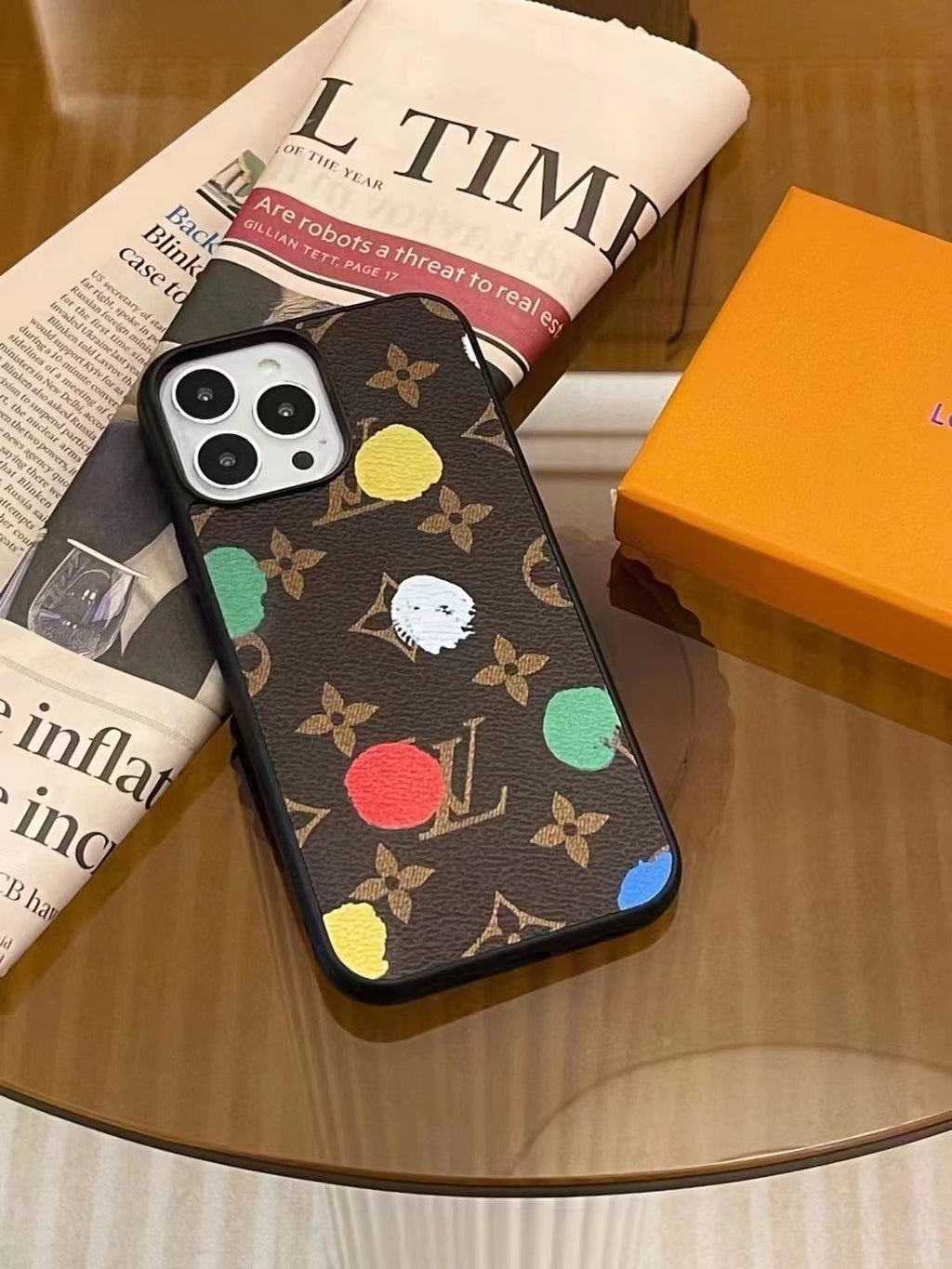 LV paint spots iPhone case showing the patterned rear cover and protective camera area