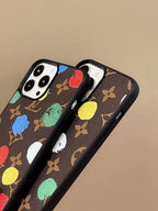 LV paint spots iPhone case side view showing the fitted buttons and slim protective profile
