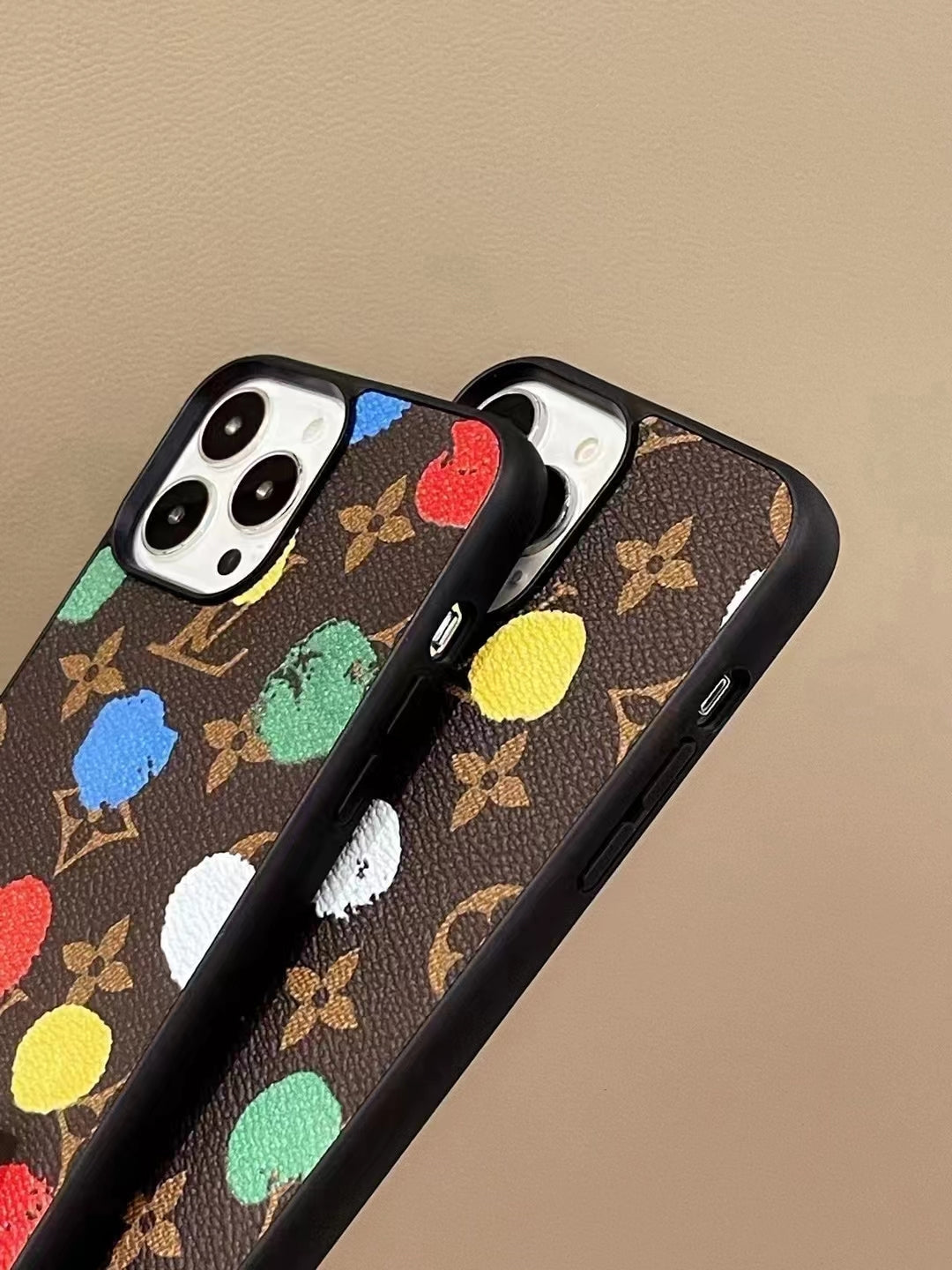LV paint spots iPhone case side view showing the fitted buttons and slim protective profile