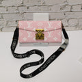 Pink monogram LV crossbody wallet iPhone case showing the shoulder strap and patterned back