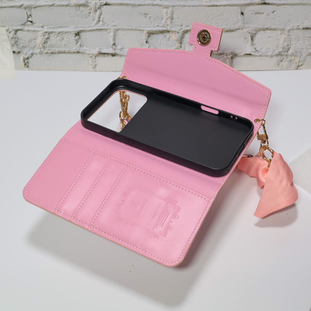 Pink monogram LV crossbody wallet iPhone case close-up showing card storage and leather finish
