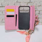 Pink monogram LV crossbody wallet iPhone case showing strap hardware and the patterned cover