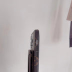Designer folding iPhone case side view showing button access and fitted edge protection