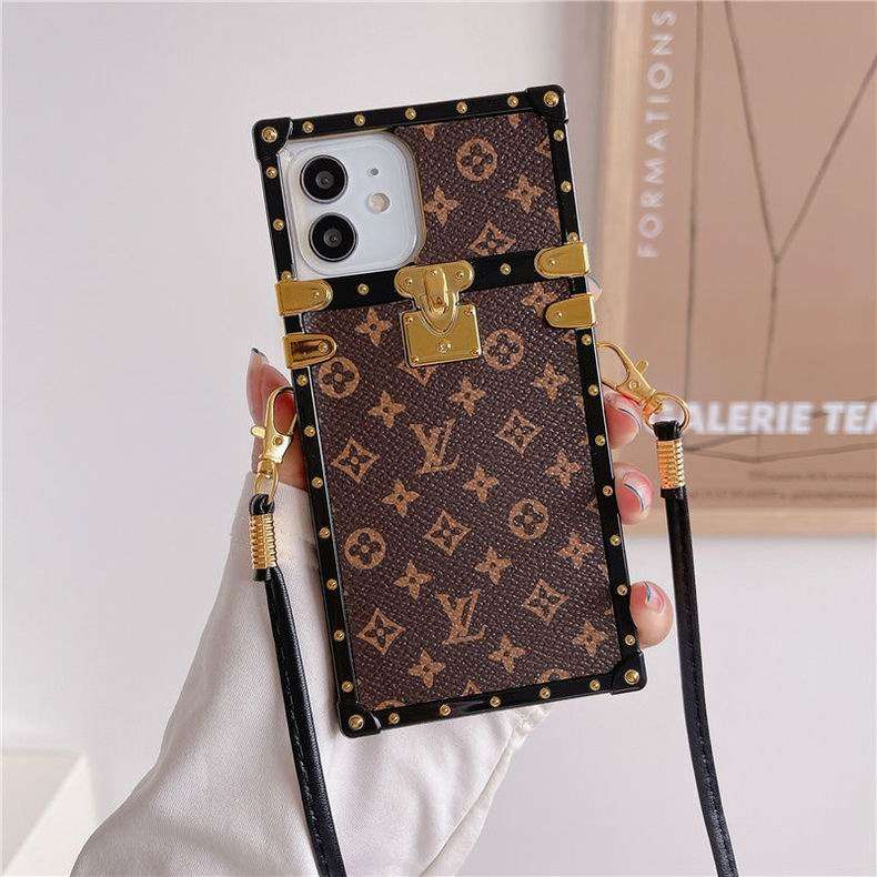 LV trunk iPhone case close-up showing the structured edges and luxury patterned finish