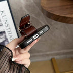 LV iPhone hand strap case showing clear port access and protective lower edge