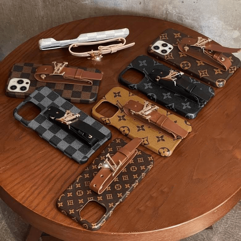 Designer iPhone case with hand strap showing the rear cover and strap attachment detail