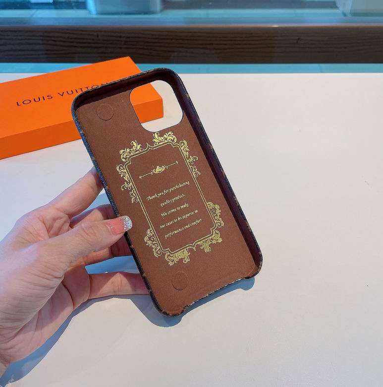 Detailed view of the LV monogram iPhone case with brown hand strap and patterned finish