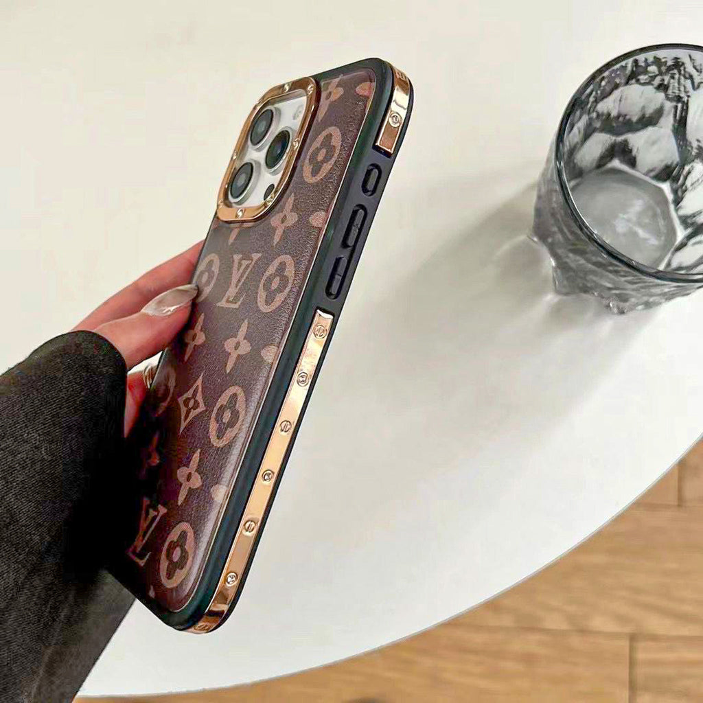Luxury LV monogram iPhone case showing the golden side trim and patterned back cover