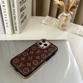 LV iPhone case with monogram design showing the polished gold-tone side protection