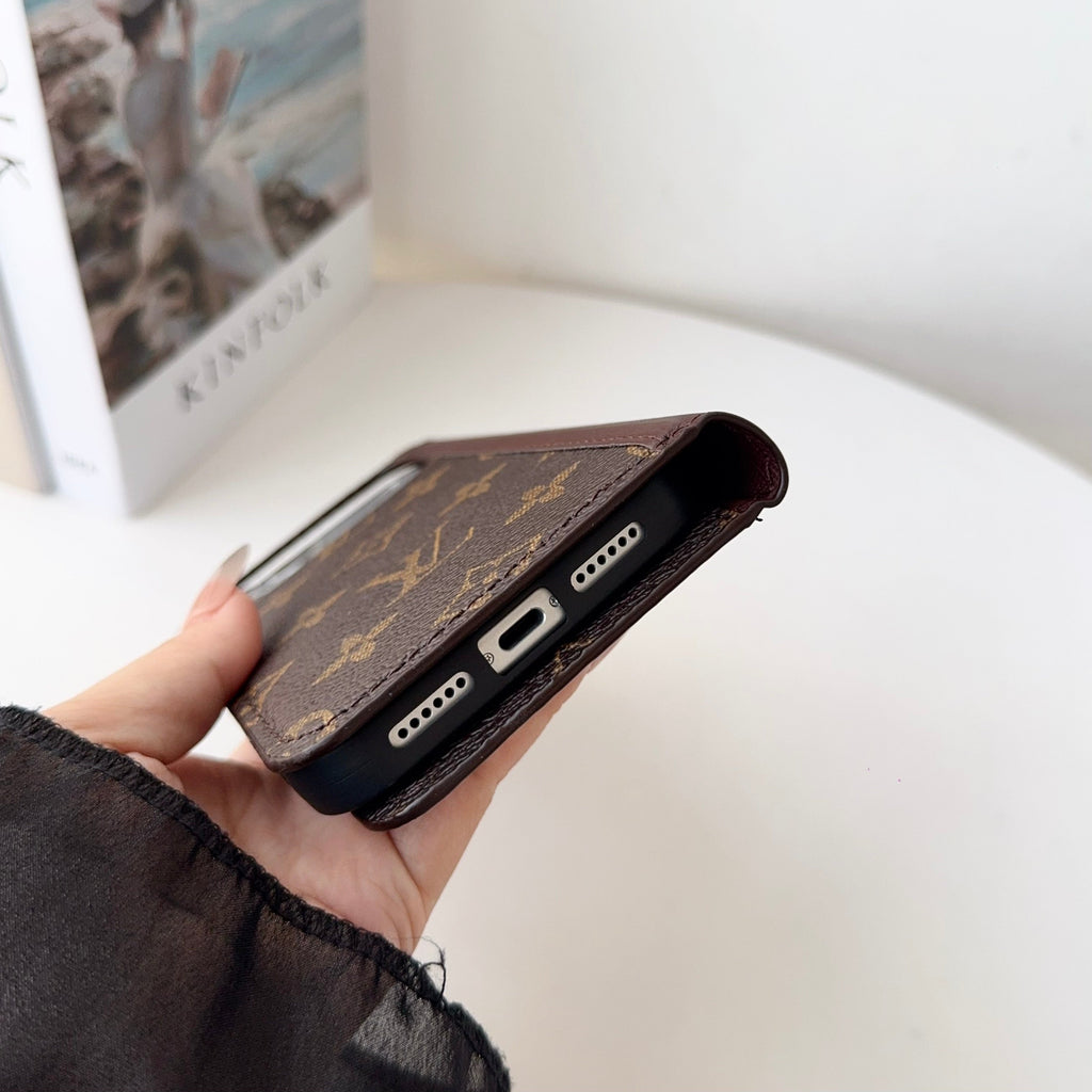 Louis V folio wallet iPhone case close-up showing the camera opening and finished edges