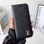 Louis V folio wallet iPhone case close-up showing the folding cover and leather finish