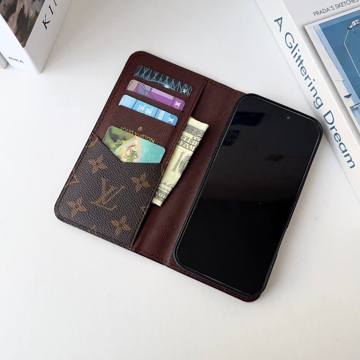 Louis V folio wallet iPhone case close-up showing leather texture and card slots