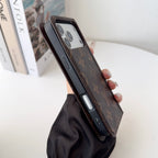 Louis V folio wallet iPhone case showing the complete protective cover and card storage