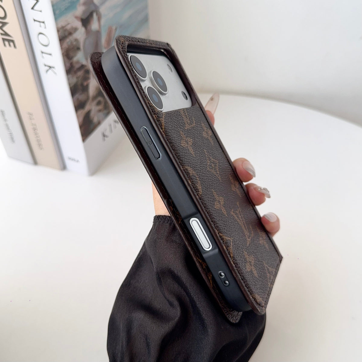 Louis V folio wallet iPhone case showing the complete protective cover and card storage
