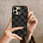 Black checkered classic leather iPhone case showing the full rear cover and finish