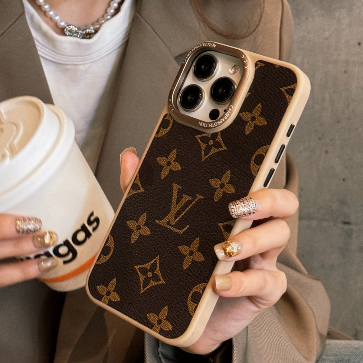 Brown monogram classic leather iPhone case showing the patterned back cover