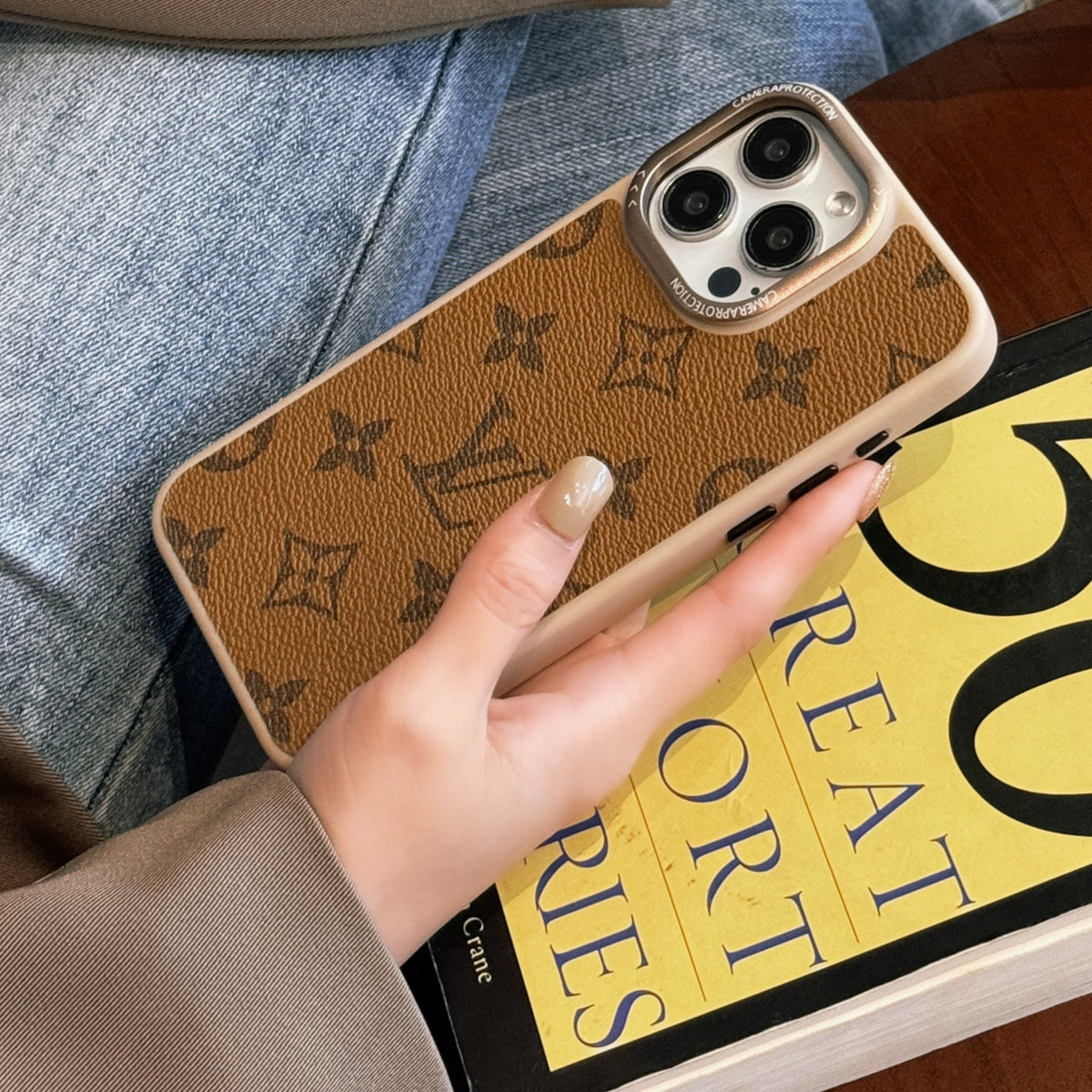 Pale monogram classic leather iPhone case showing the light patterned finish
