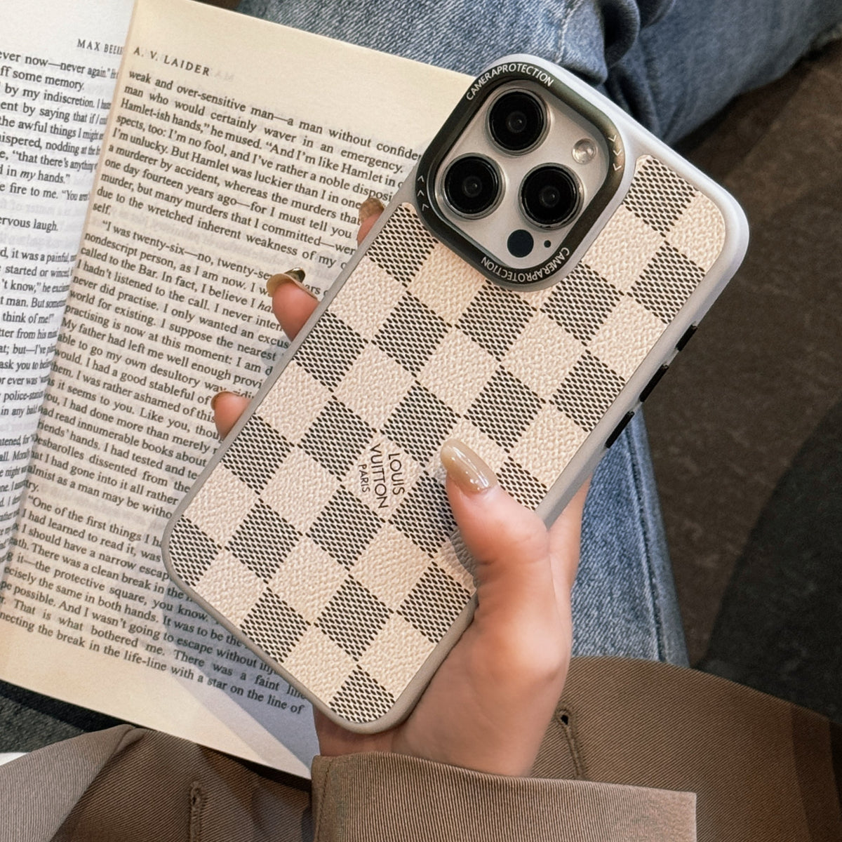 White checkered classic leather iPhone case showing the bright patterned rear cover