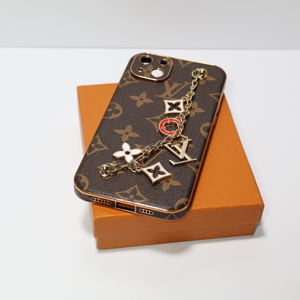 Ornament hand strap iPhone case showing the slim wallet design and finished edges