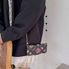 LV folio card holder iPhone case showing the fitted camera opening and protective folding cover