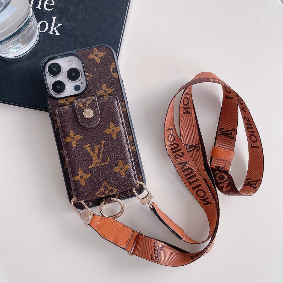Large monogram Louis Vuitton crossbody card holder iPhone case showing the patterned rear cover