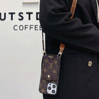 Louis Vuitton crossbody card holder iPhone case shown on body with the carrying strap