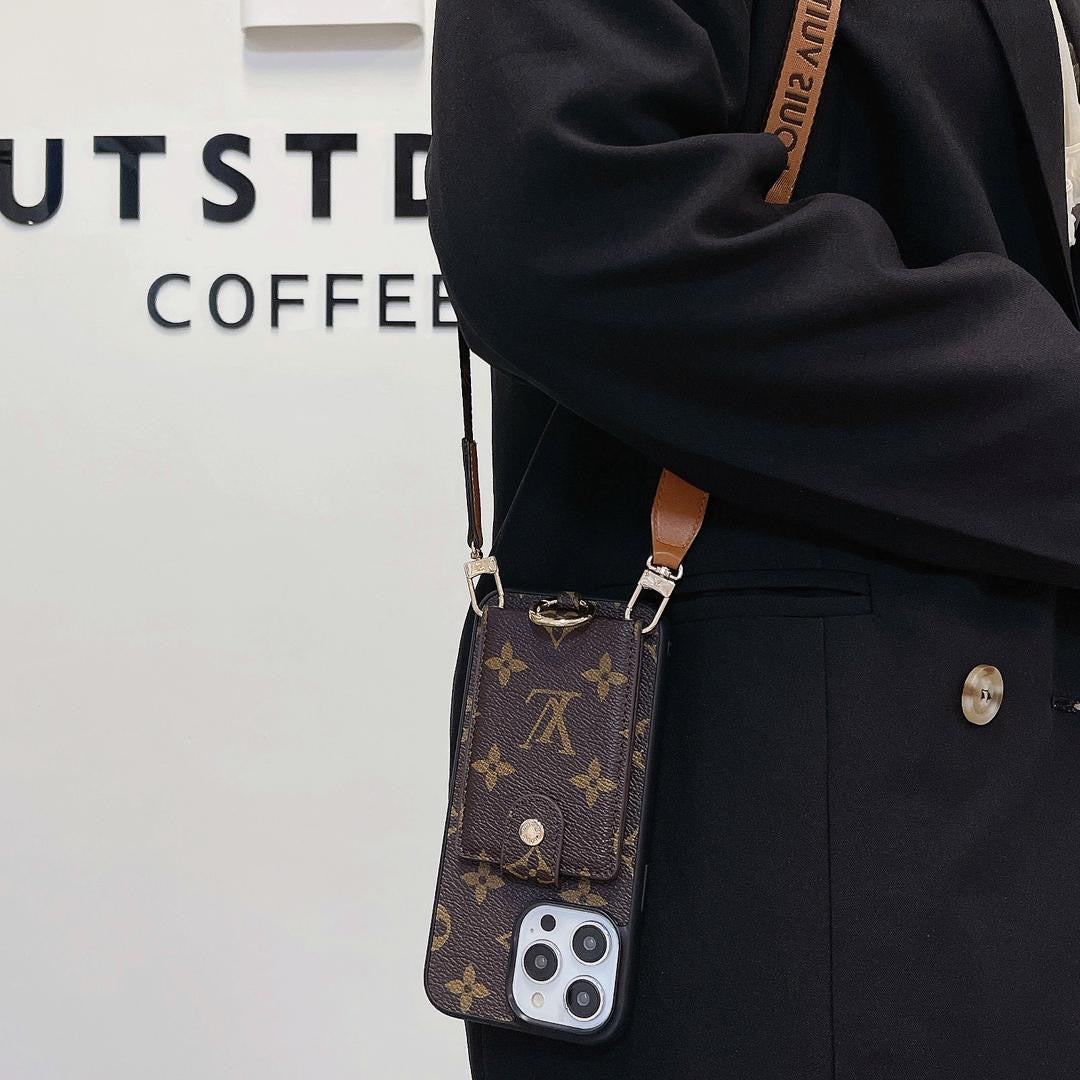 Louis Vuitton crossbody card holder iPhone case shown on body with the carrying strap