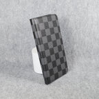 Black classic LV iPhone wallet case showing the patterned folio cover and card holder