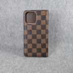 Brown checkered Louis Vuitton iPhone wallet case showing the folding cover and card storage