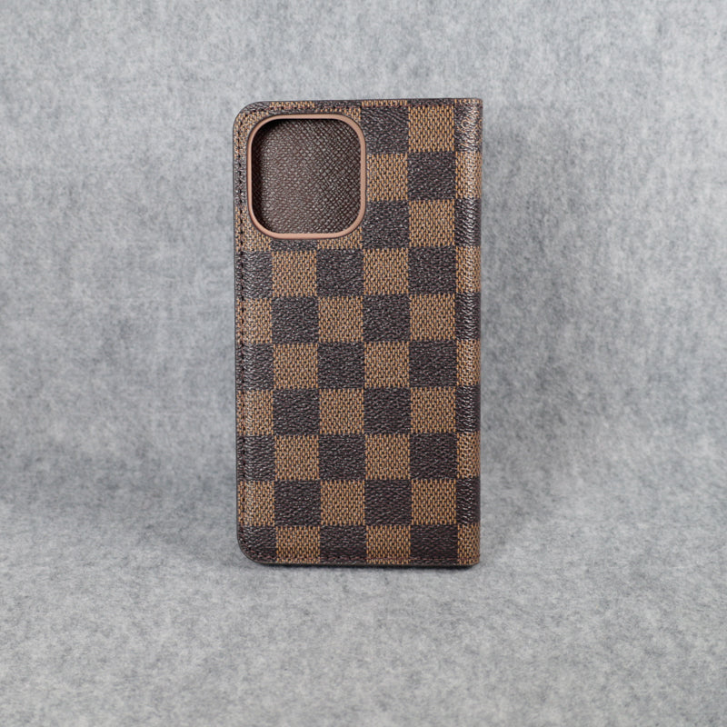 Brown checkered Louis Vuitton iPhone wallet case showing the folding cover and card storage