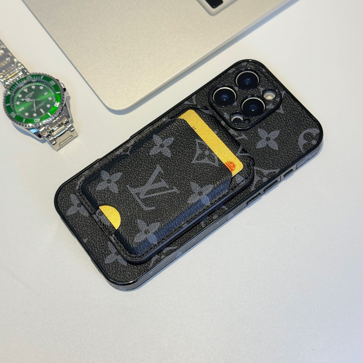 Black monogram LV MagSafe iPhone case showing the magnetic card holder and dark finish