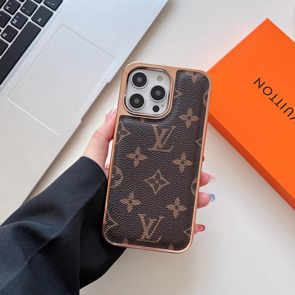 Luxury leather iPhone case showing the patterned back and rhinestone camera lens surround