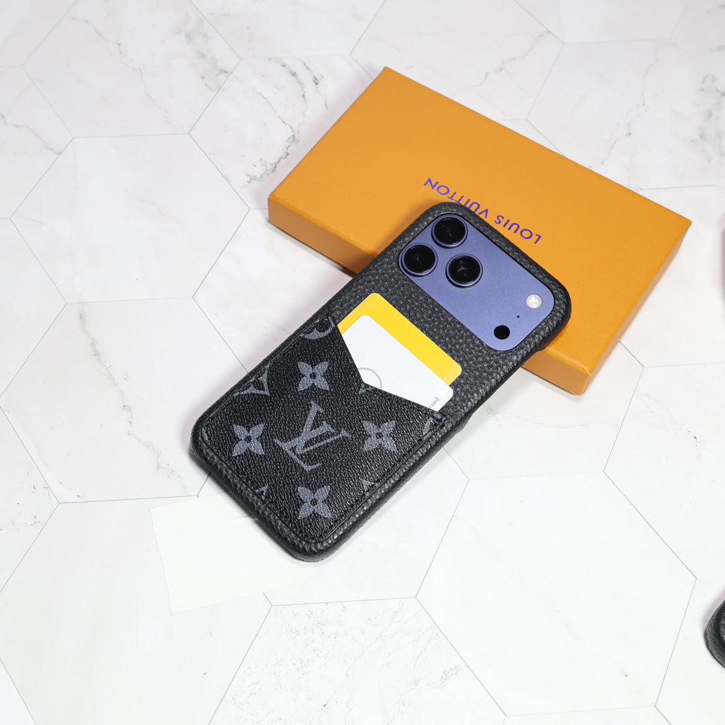 Black monogram LV iPhone case showing the dark patterned back and protective camera area