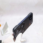 Black monogram iPhone case shown from the rear with slim edge protection and pattern