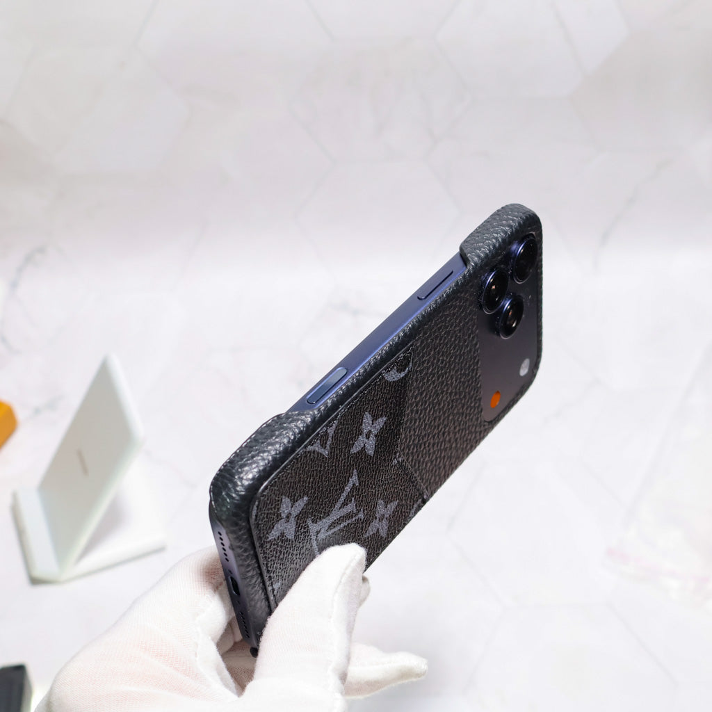 Black monogram iPhone case shown from the rear with slim edge protection and pattern