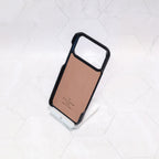 Close-up of the black monogram iPhone case highlighting leather texture and pattern