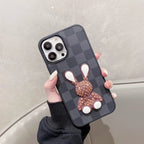 Black checkered 3D designer iPhone case front view showing the dark patterned protective cover
