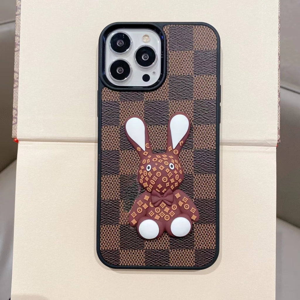 Brown checkered 3D designer iPhone case front view showing the textured protective design