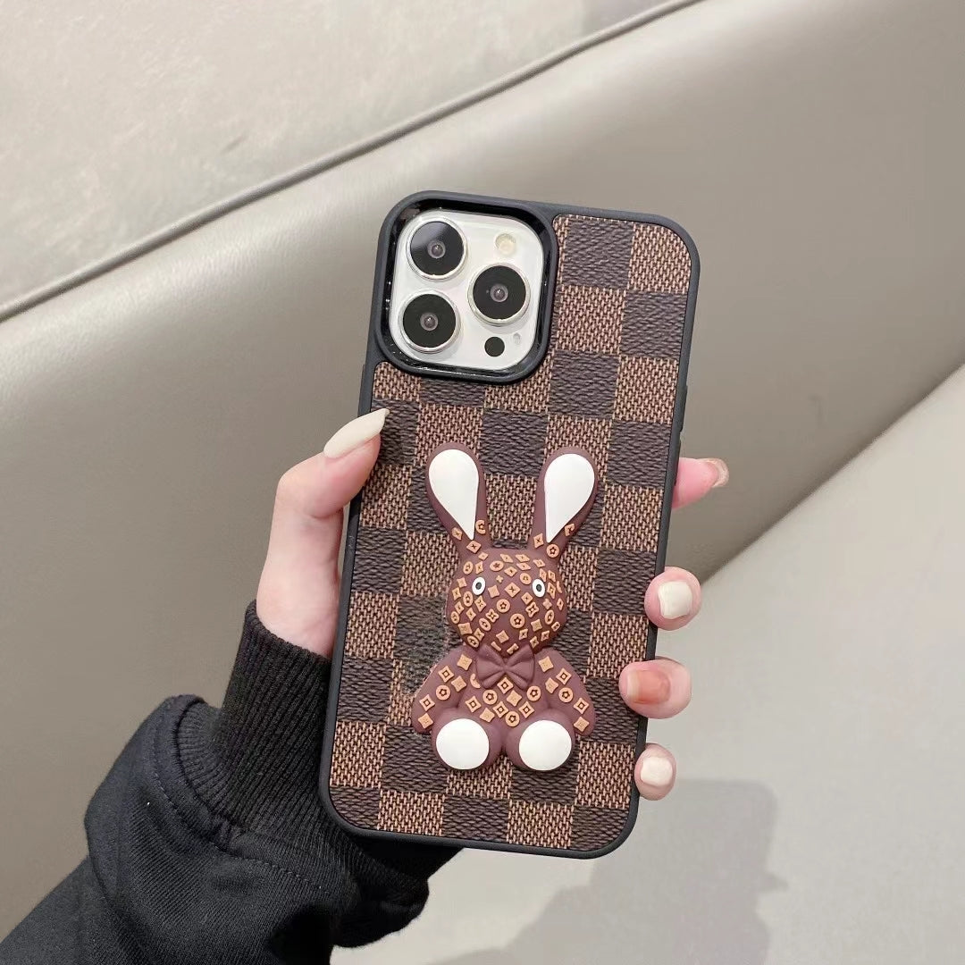 Brown checkered 3D designer iPhone case showing the raised patterned rear cover