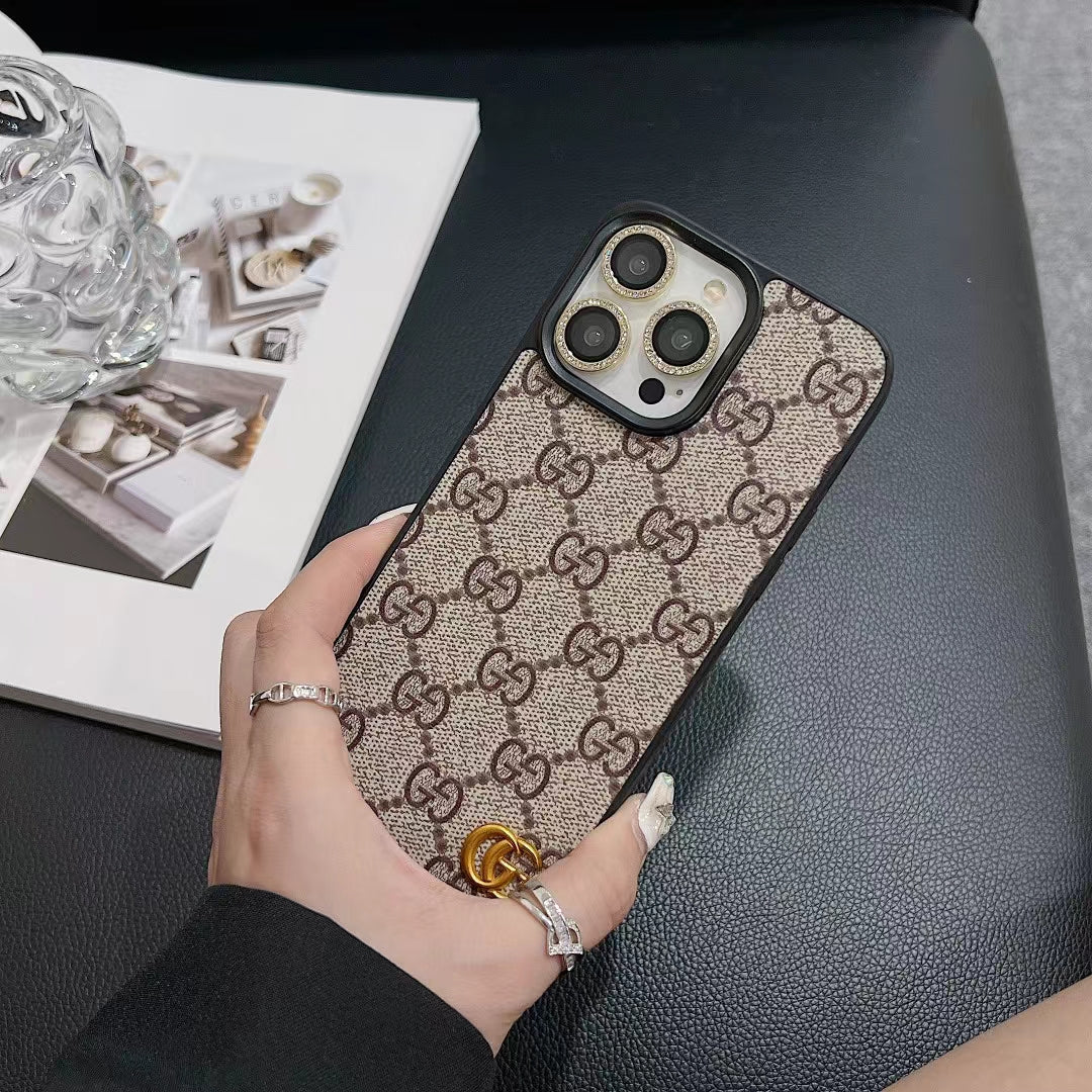 Close-up of the LV monogram luxury iPhone case highlighting the leather pattern and finish