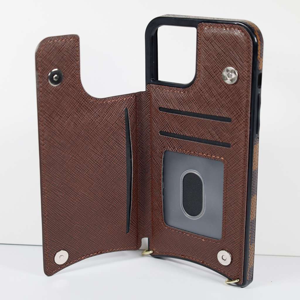 Checkered leather crossbody iPhone case close-up showing leather texture and strap detail