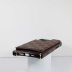 Checkered leather crossbody iPhone case showing the patterned back and finished corners