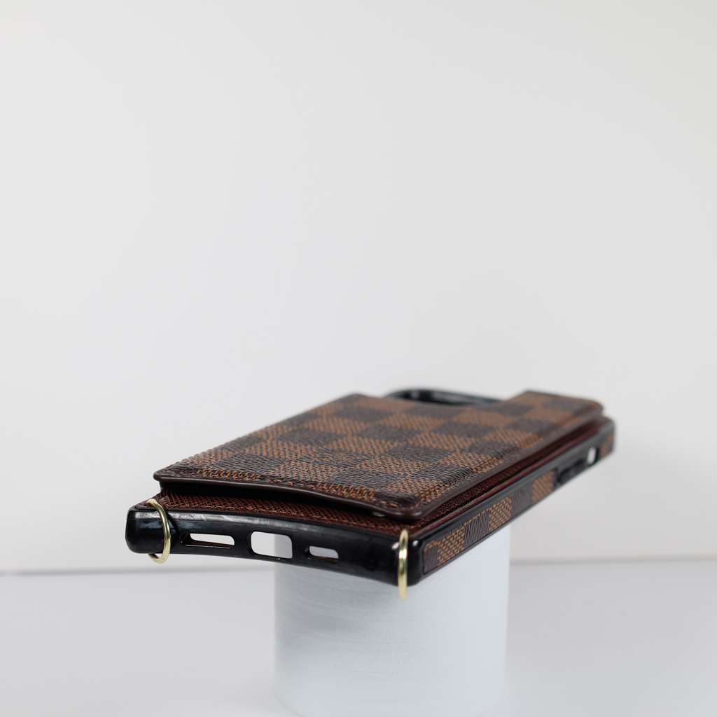 Checkered leather crossbody iPhone case showing the patterned back and finished corners