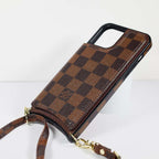 Checkered leather crossbody iPhone case shown with the shoulder strap for hands-free carrying