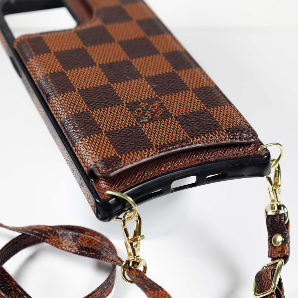 Checkered leather crossbody iPhone case showing the leather back, camera opening and protective corners